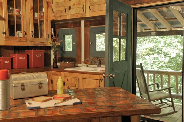 The hinges and doorknobs were the only things the Bakers bought for the kitchen; everything else is salvaged. “I think we spent $20 in there, total,” Guy says.